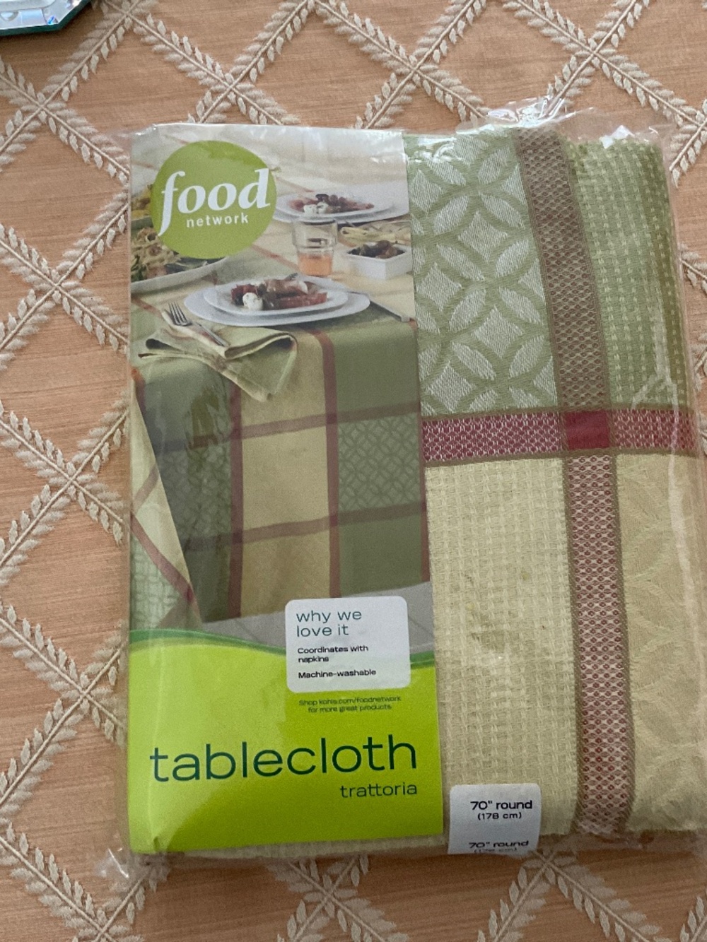 Food Network 70” round tablecloth in original package.  Beautiful pattern.